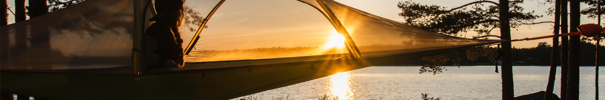 natuur_klamboe_bomen_gras_zonsondergang_un